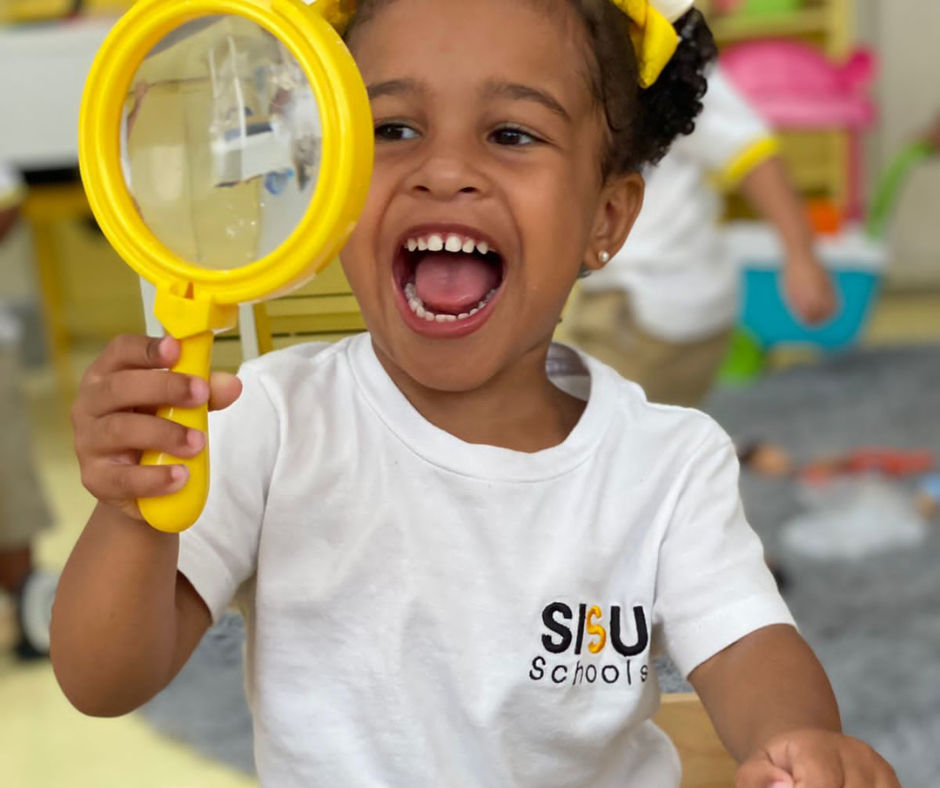 Curious early learner exploring the world at SISU Schools inspired by Finnish education